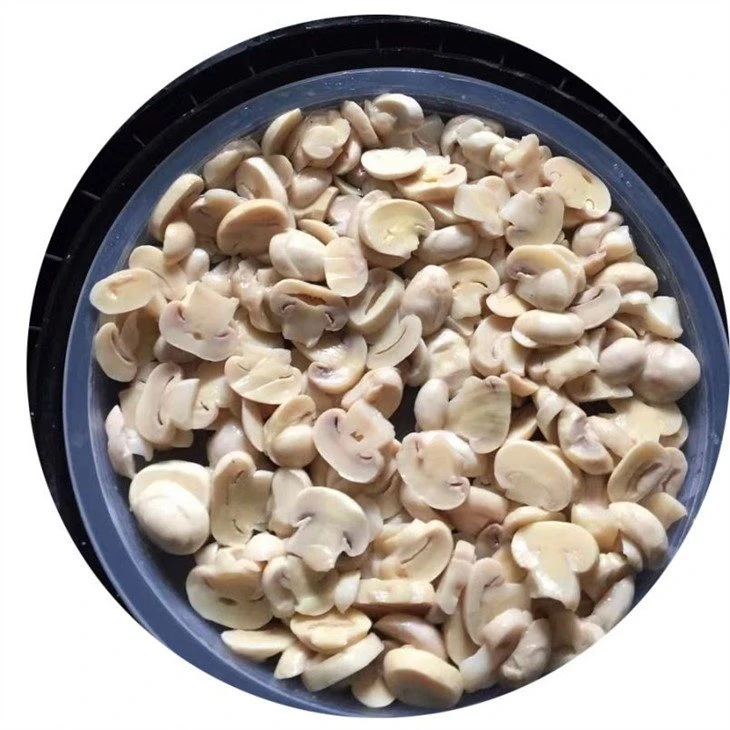 Sliced white champignon in brine in drums
